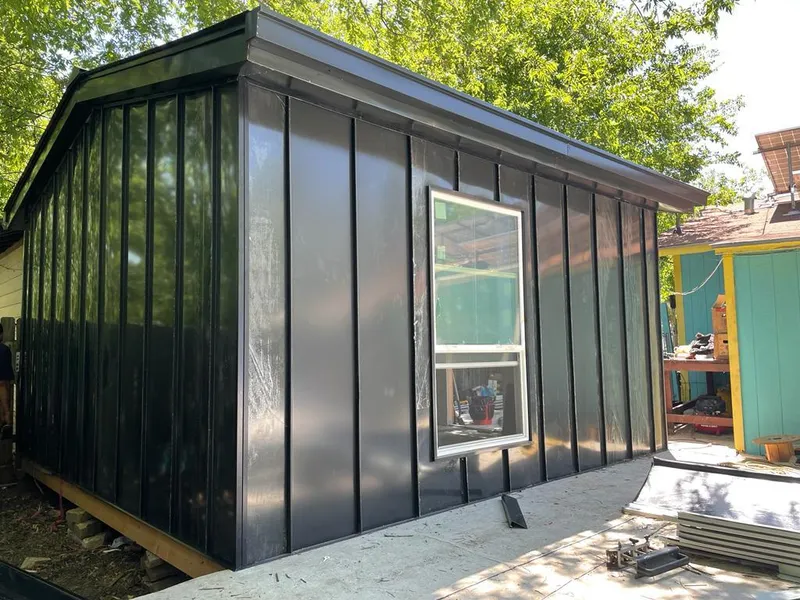 Black standing seam metal wall panels for Metal Roof Installation in Harrison